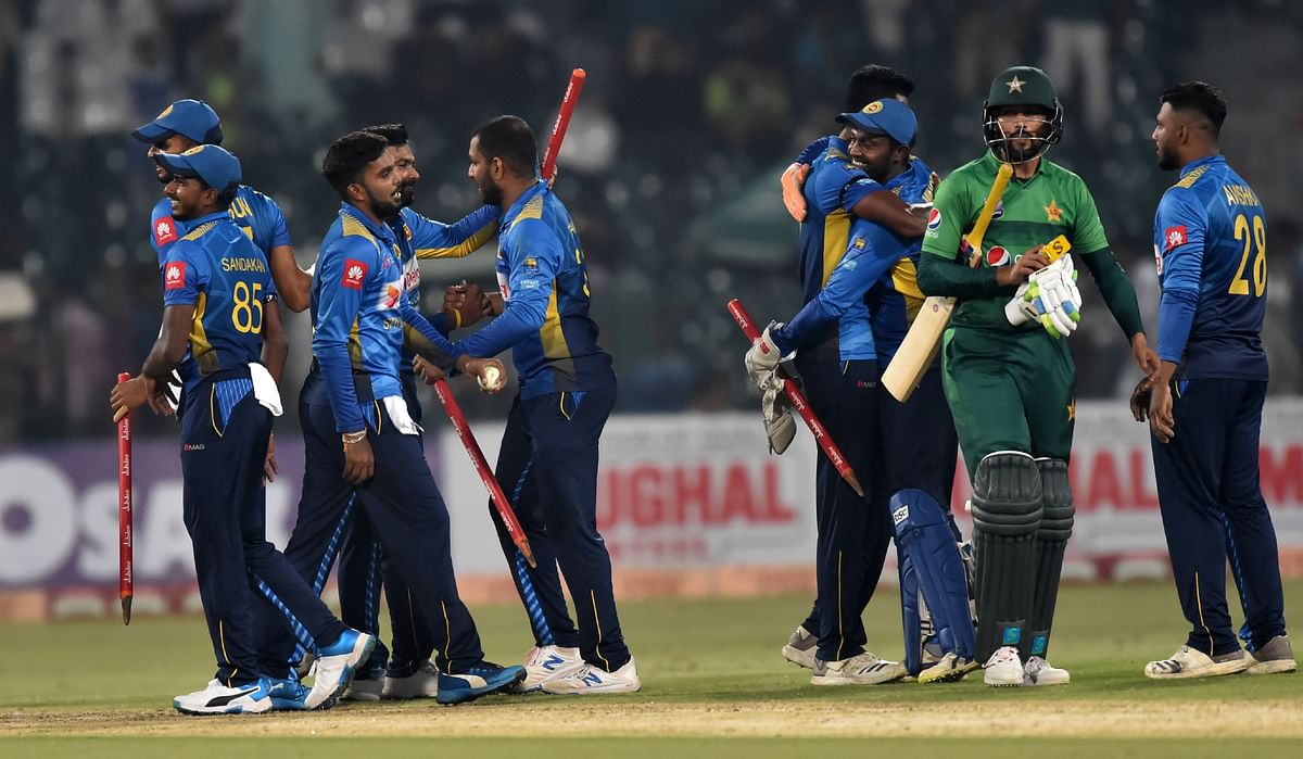 Sri Lanka`s cricketers celebrate after beating Pakistan during the second Twenty20 International cricket match between Pakistan and Sri Lanka at the Gaddafi Cricket Stadium in Lahore on 7 October 2019. Photo: AFP
