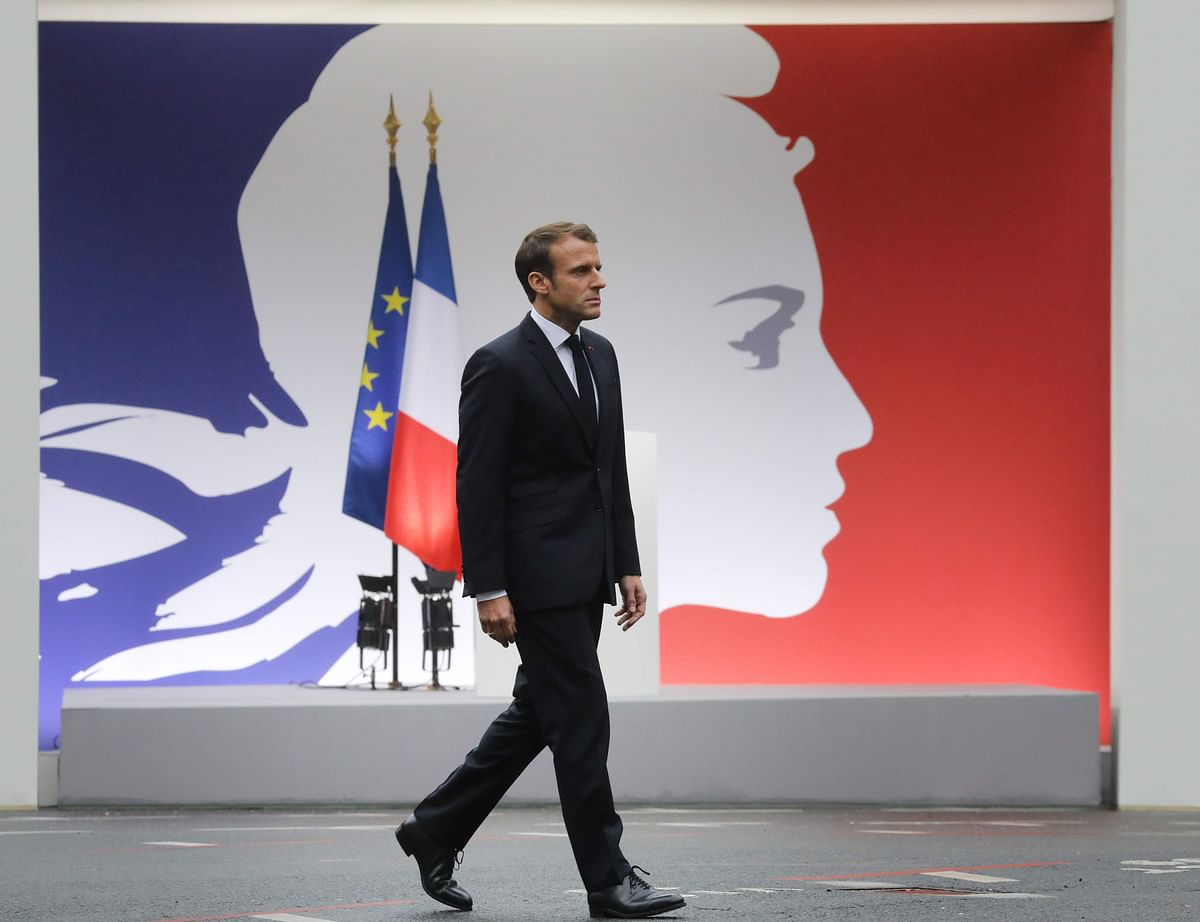 French president Emmanuel Macron takes part in a ceremony at The Prefecture de Police de Paris (Paris Police Headquarters) in Paris on 8 October 2019, held to pay respects to the victims of an attack at the prefecture on 4 October 2019. Photo: AFP
