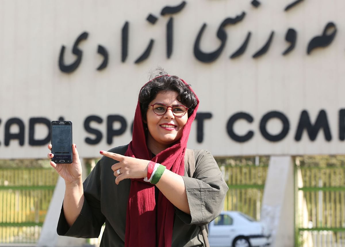 Iranian sports journalist Raha Pourbakhsh shows purchased electronic tickets for the Iran - Cambodia World Cup 2022 qualifier match during an interview with AFP in front of Azadi stadium in the capital Tehran on 8 October 2019. Photo: AFP