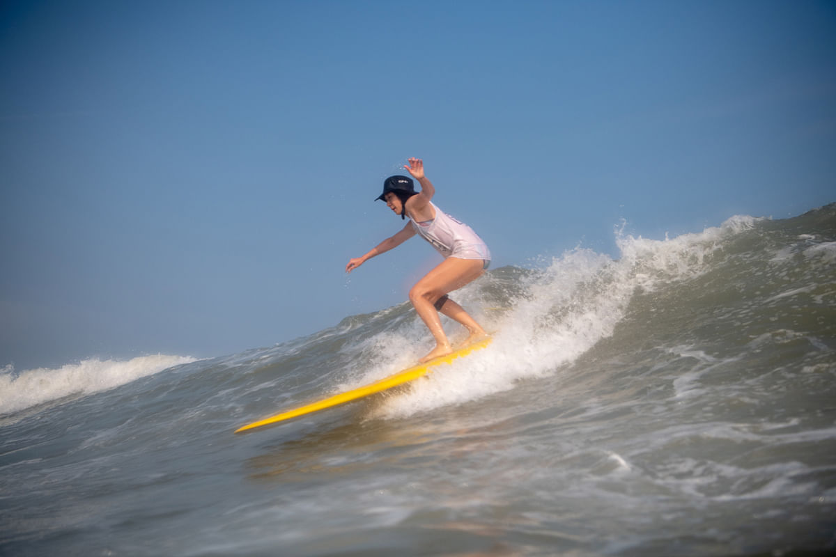 In this picture taken on 4 August 2019, a surfer rides a wave at Shilaoren Beach in Qingdao, eastern China`s Shandong province. Photo: AFP