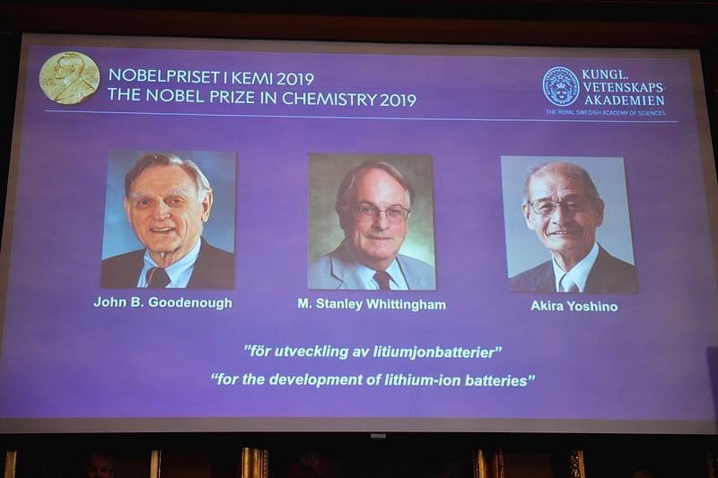 A screen displays the portraits of the laureates of the 2019 Nobel Prize in Chemistry (L-R) John Goodenough of US, Britain`s Stanley Whittingham and Japan`s Akira Yoshino during a press conference at the Royal Swedish Academy of Sciences in Stockholm, Sweden, on 9 October 2019. Photo: AFP