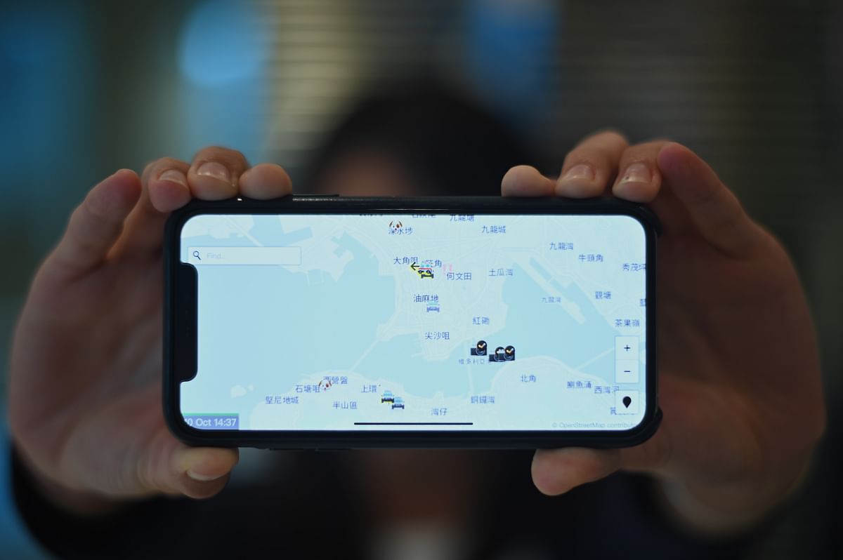 This photo illustration shows a smartphone displaying the `HKmap.live` app in Hong Kong on 10 October 2019. Apple on 10 October removed an app criticised by China for allowing protesters in Hong Kong to track police, as Beijing steps up pressure on foreign companies deemed to be providing support to the pro-democracy movement. Photo: AFP