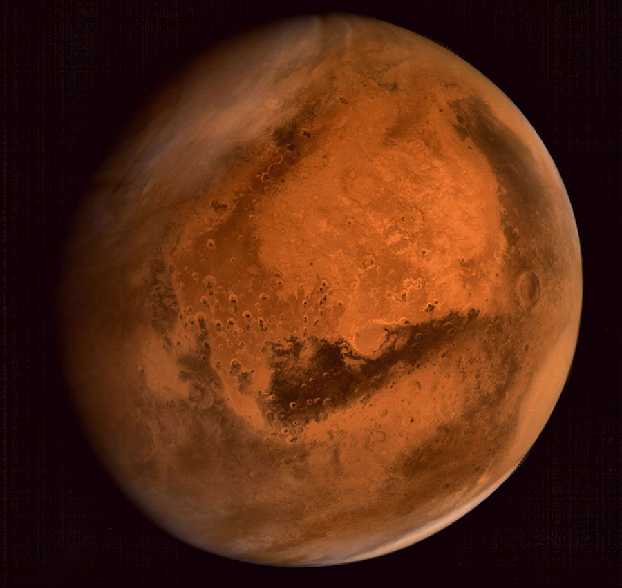 In this handout file photo received from the Indian Space Research Organisation (ISRO) on 30 September 2014 the planet Mars is seen in an image taken by the ISRO Mars Orbiter Mission (MOM) spacecraft. Photo: AFP