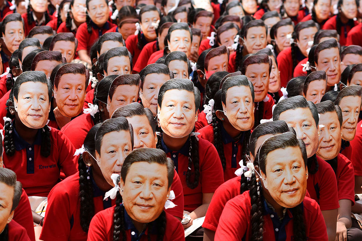 Indian school students wear masks of China`s president Xi Jinping in Chennai on 10 October 2019, ahead of a summit with his Indian counterpart Narendra Modi held at the World Heritage Site of Mahabalipuram from 11 to 13 October in Tamil Nadu, India. Photo: AFP