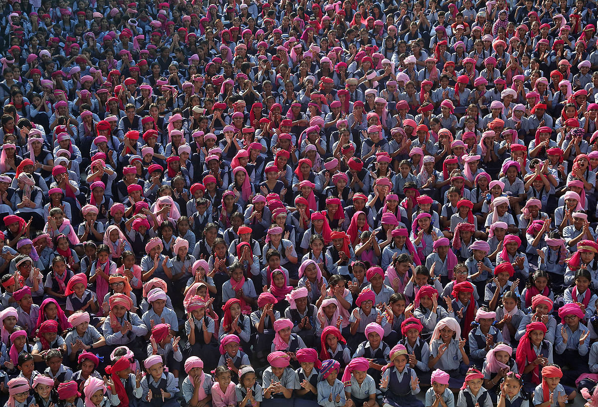 Schoolgirls wearing pink turbans cheer during celebrations to mark International Day of the Girl Child, at a school in Chandigarh, India, on 11 October 2019. Photo: Reute