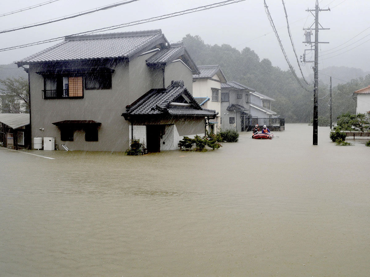 Heavy rains caused by Typhoon Hagibis flood a residential area in Ise, central Japan, in this photo taken by Kyodo on 12 October 2019. Photo: Reuters