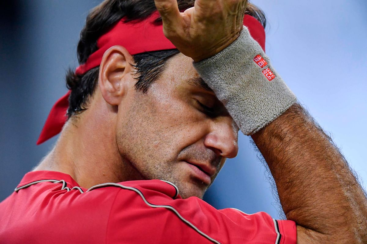Roger Federer of Switzerland gestures while playing against Alexander Zverev of Germany during their men`s singles quarter-final match at the Shanghai Masters tennis tournament in Shanghai on 11 October 2019. Photo: AFP