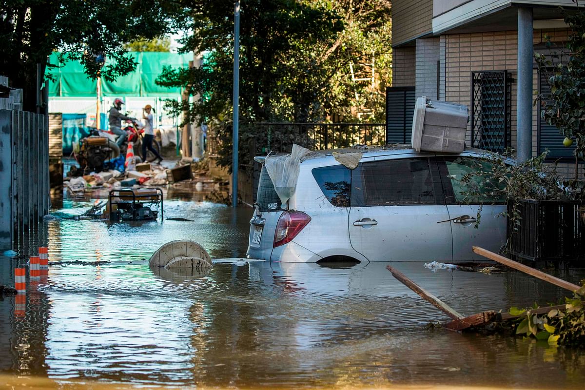 Flooded vehicles are seen in the aftermath of Typhoon Hagibis in Kawasaki on 13 October. Photo: AFP