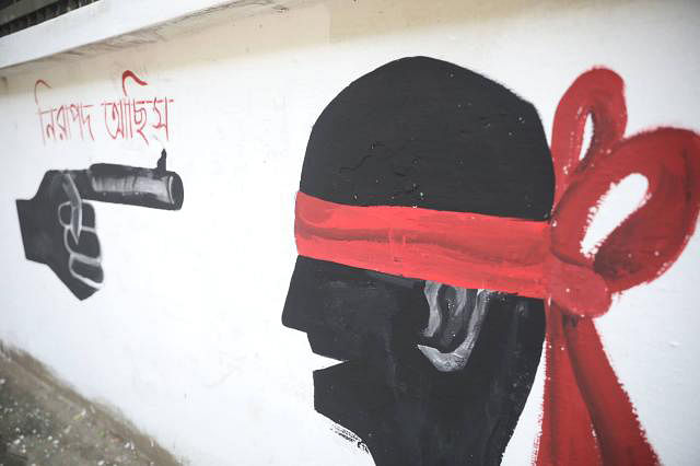 Graffiti reading `Are you safe?` shows a gun-like finger pointing at a blindfolded person.