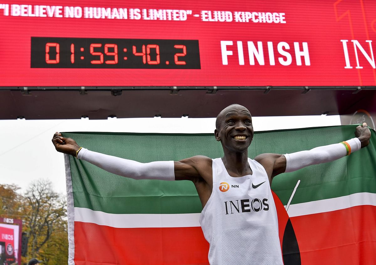 Kenya`s Eliud Kipchoge (white jersey) celebrates after busting the mythical two-hour barrier for the marathon on Saturday in Vienna. Kipchoge holds the men`s world record for the distance with a time of 2hr 01min 39sec, which he set in the flat Berlin marathon on 16 September 2018.
