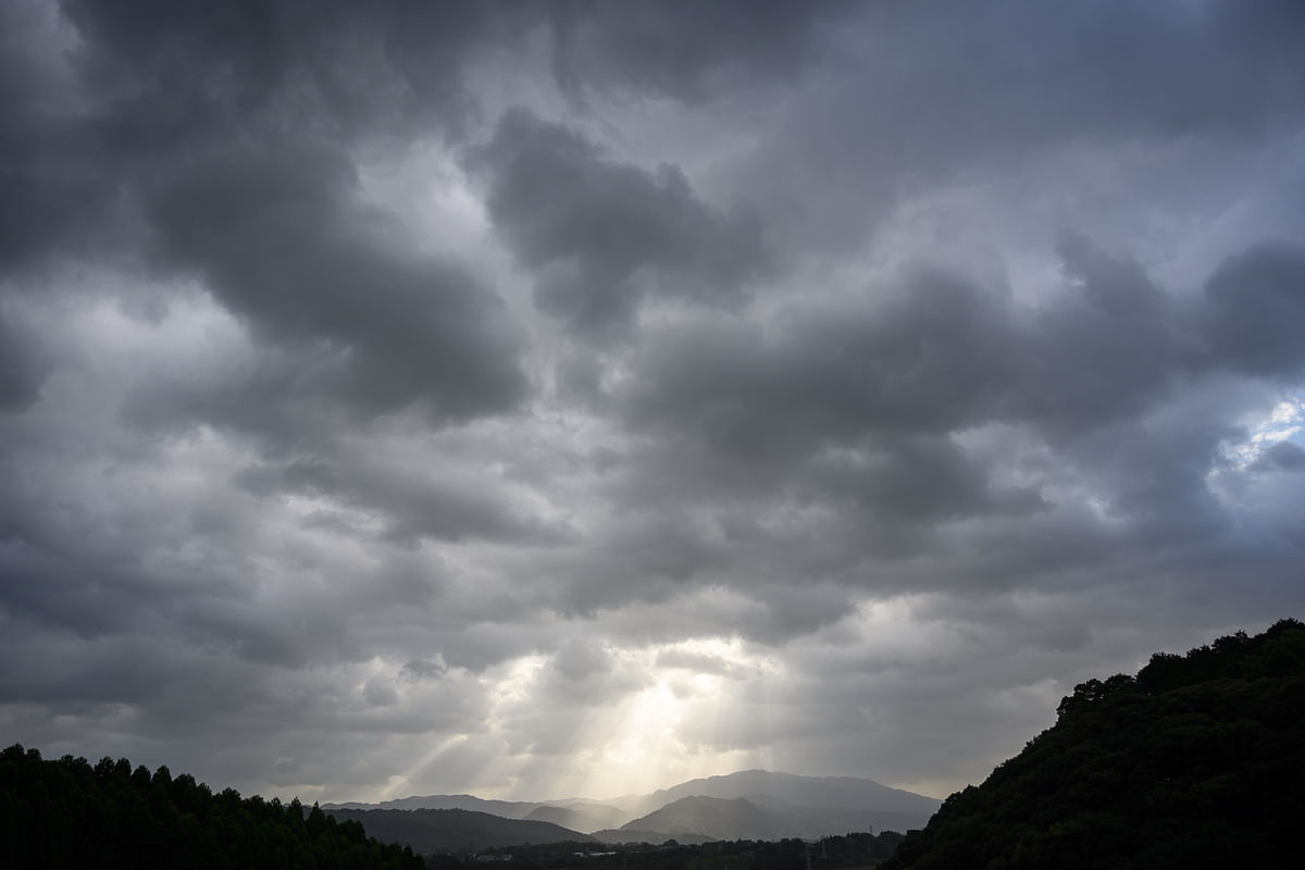 The sun peaks out from behind a band of dark clouds between Oita and Fukuoka on southern Kyushu island on 12 October 2019, as powerful Typhoon Hagibis roared far towards the north to the coasts off central and eastern Japan. Photo: AFP