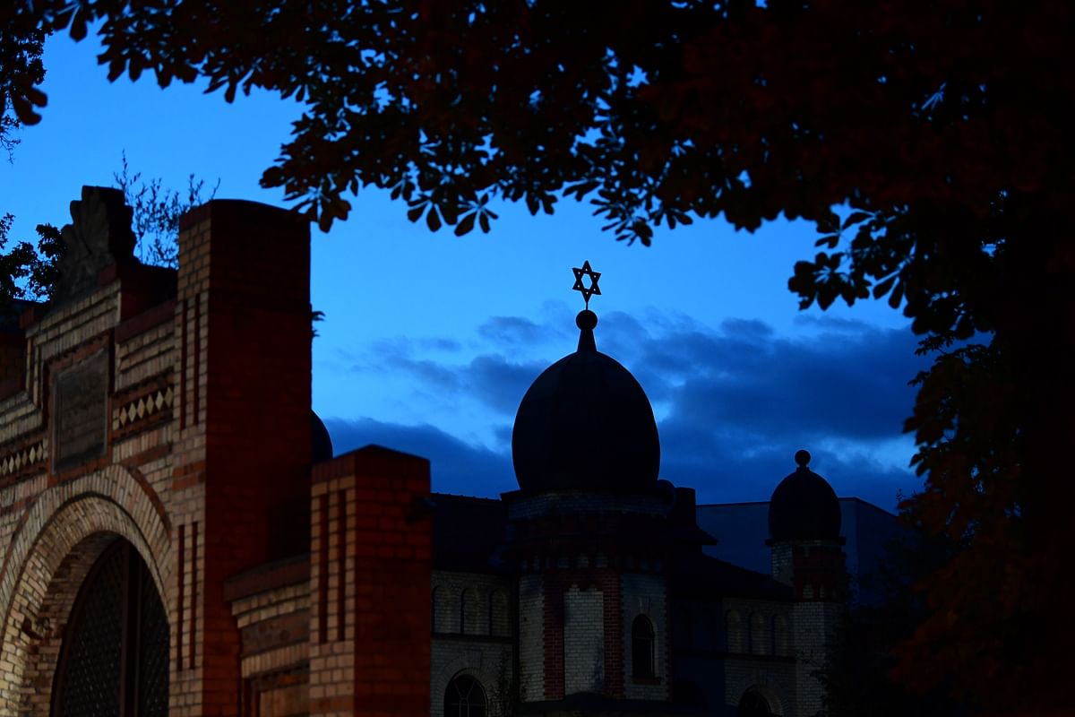 A Star of David on the cupola of the Halle synagogue silhouettes against the evening sky on 10 October 2019 in Halle an der Saale, eastern Germany, one day after the deadly anti-Semitic shooting. Photo: AFP