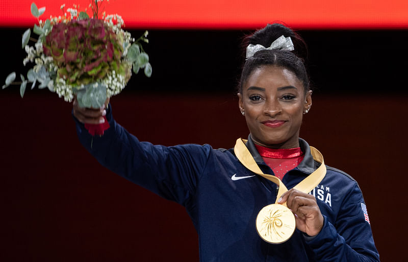 USA`s Simone Biles celebrates wnning the gold medal on the podium during the medal ceremony for the Women`s vault after the apparatus finals at the FIG Artistic Gymnastics World Championships at the Hanns-Martin-Schleyer-Halle in Stuttgart, southern Germany, on 12 October 2019. Photo: AFP