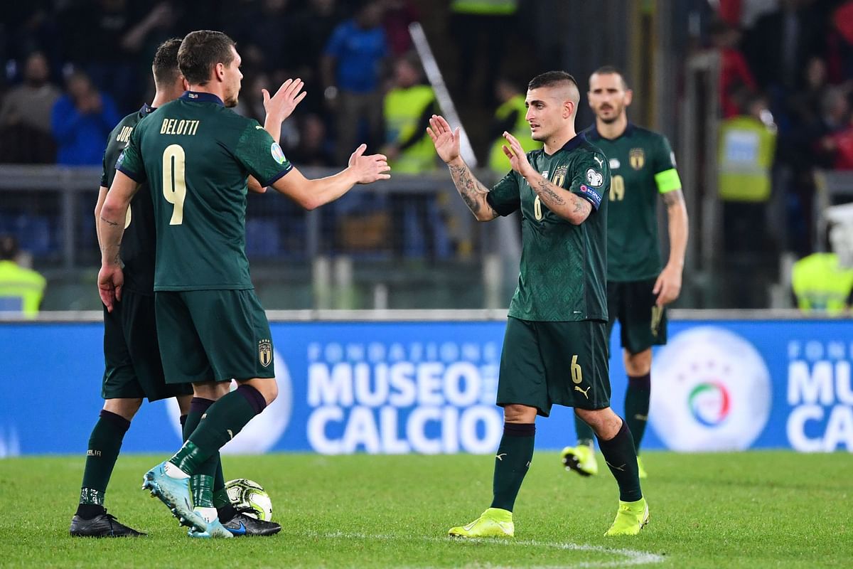 Italy`s midfielder Marco Verratti (R) celebrates with Italy`s forward Andrea Belotti (C) and Italy`s midfielder Jorginho after winning the UEFA Euro 2020 Group J qualifier football match between Italy and Greece at the Stadio Olimpico stadium in Rome, on Saturday. Photo: AFP