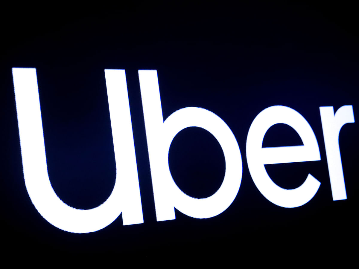 A screen displays the company logo for Uber Technologies Inc. Photo: Reuters