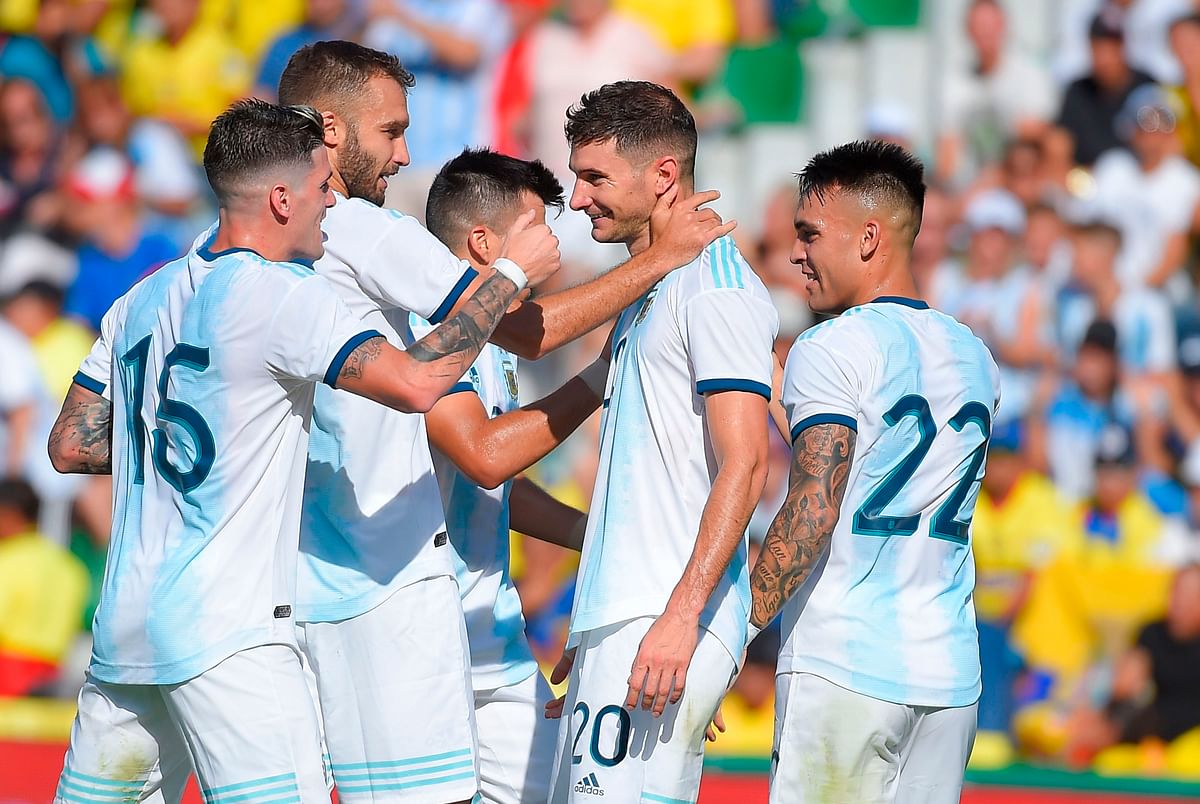 Argentina`s midfielder Lucas Alario (2R) celebrates with teammates after scoring during the International Friendly football match against Ecuador at the Martinez Valero stadium in Elche, on Sunday. Photo: AFP