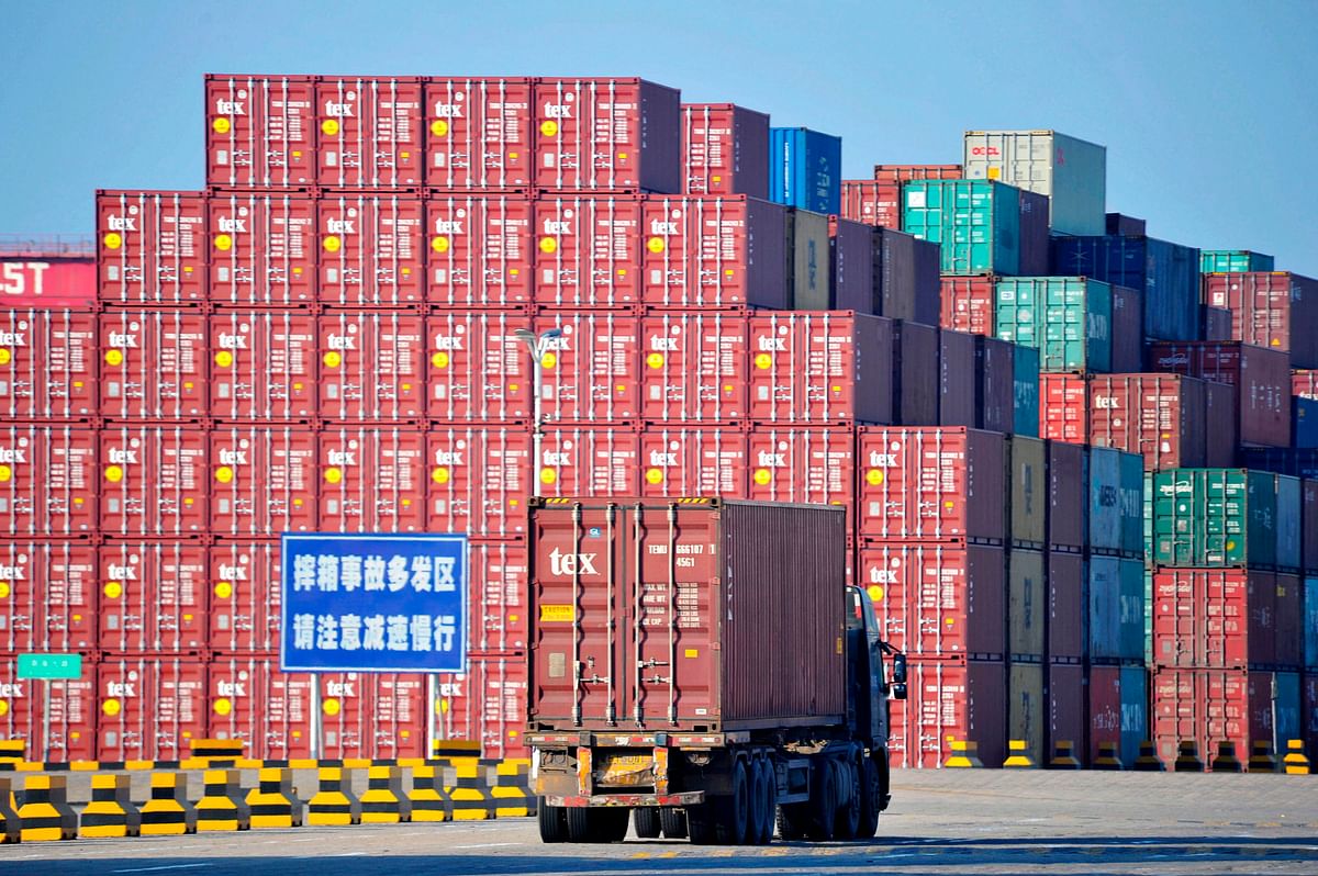 This file photo taken on 24 June 2019 shows containers at the Qingdao Port Foreign Trade Container Terminal in Qingdao, in China`s eastern Shandong province. A partial US-China deal may only offer a temporary tariff reprieve because it lacks specifics and leaves the thorny issues for later, analysts said, allowing both economic powers to claim success. Photo: AFP