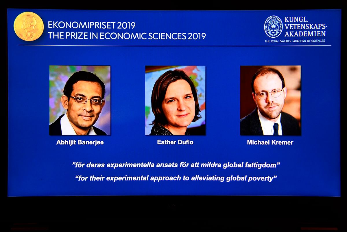 A computer screen displays the co-winners of the 2019 Sveriges Riksbank Prize in Economic Sciences in Memory of Alfred Nobel (L-R) Abhijit Banerjee, Esther Duflo and Michael Kremer during a press conference at the Royal Swedish Academy of Sciences in Stockholm, Sweden, on 14 October 2019. Indian-born Abhijit Banerjee of the US, French-American Esther Duflo and Michael Kremer of the US won the Nobel Economics Prize for their `experimental approach to alleviating global poverty`, the Royal Swedish Academy of Sciences said. Photo: AFP