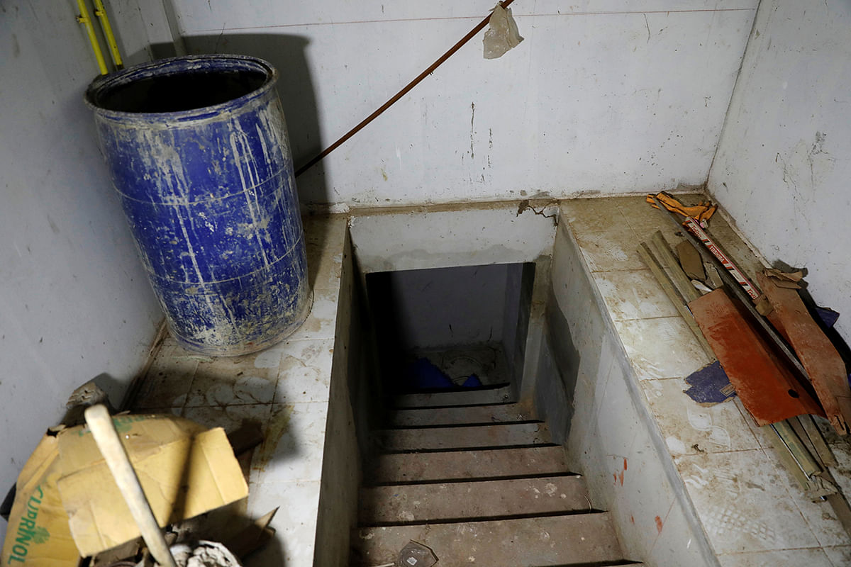 An entrance to a tunnel is seen inside a raided compound belonging to Sue Songkittikul, a suspected Sam Gor syndicate operations chief, in Mae Sot. Photo: Reuters