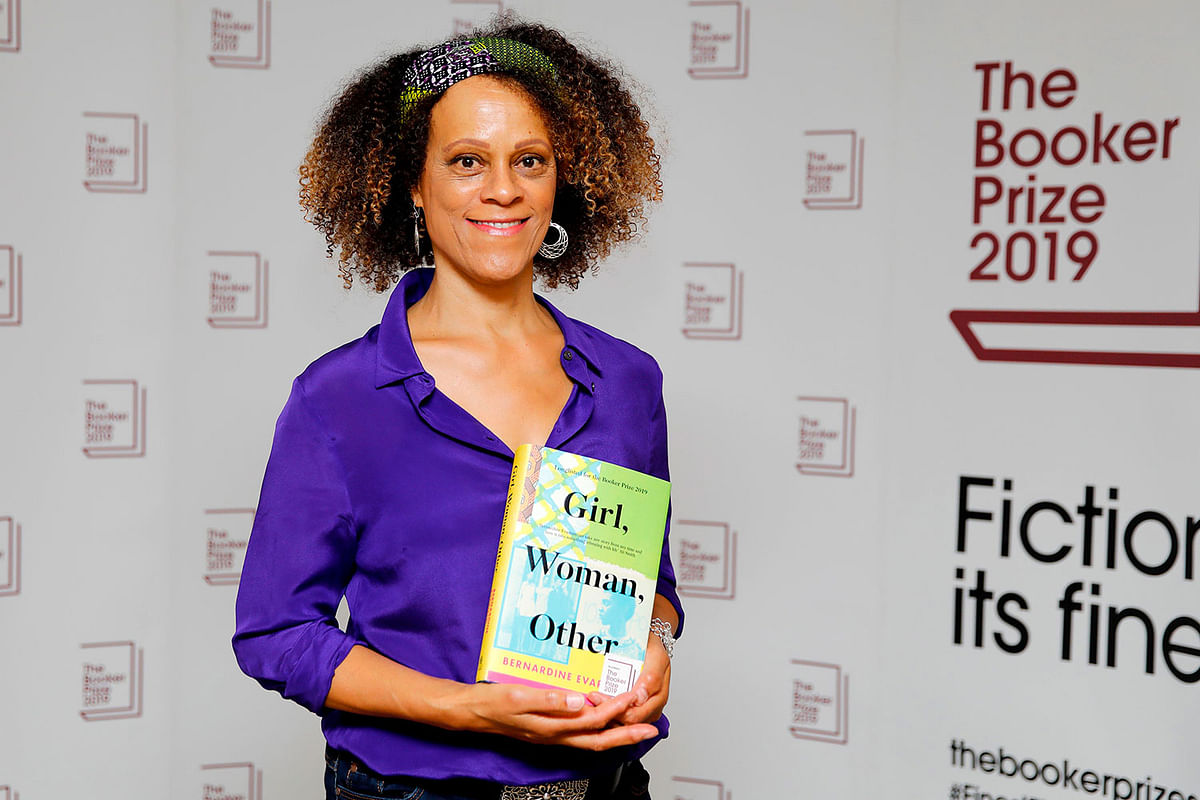 British author Bernardine Evaristo poses with her book `Girl, Woman, Other` during the photo call for the authors shortlisted for the 2019 Booker Prize for Fiction at Southbank Centre in London on October 13, 2019.