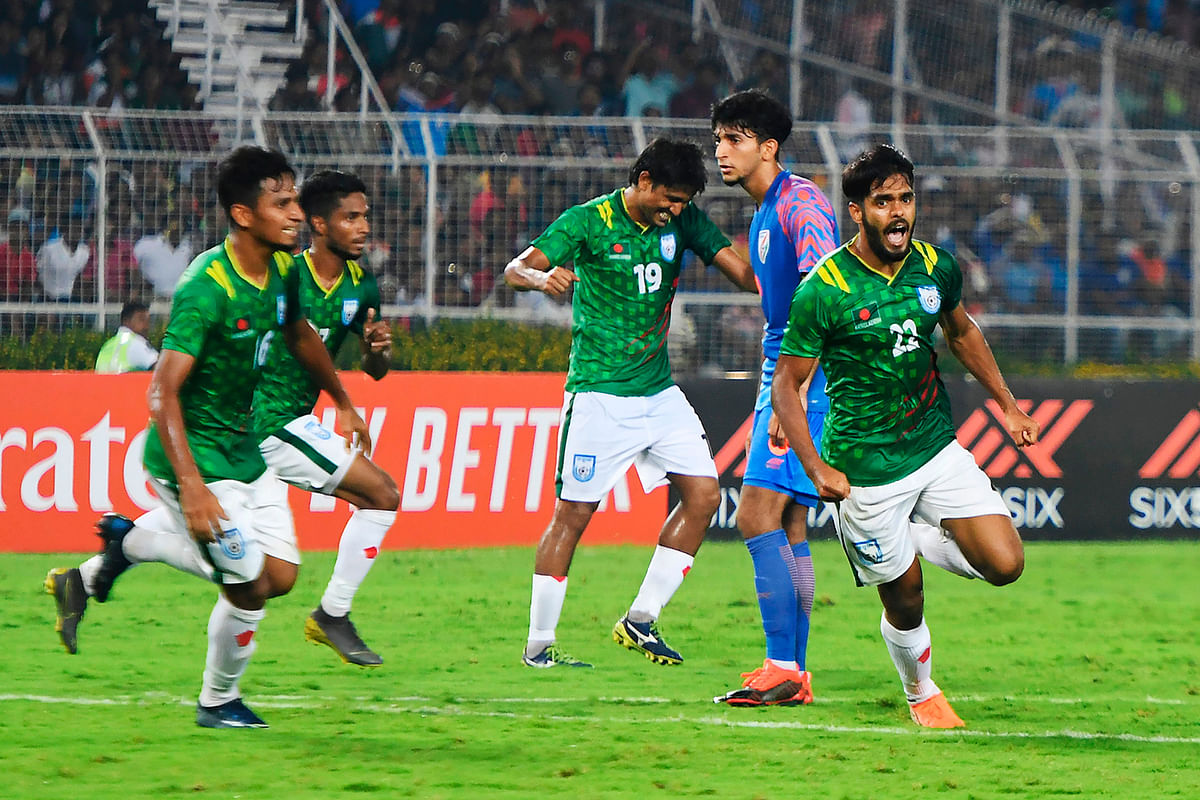 Bangladesh`s Saad Uddin (R) celebrates after scoring a goal during the World Cup 2022 and 2023 AFC Asian Cup qualifying football match between India and Bangladesh, at the Vivekananda Yuba Bharati Krirangan in Kolkata on 15 October 2019. Photo: AFP