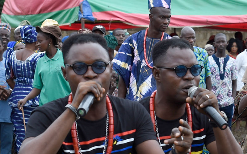 Identical twin brothers and hip-hop artists Alese Kehinde Akat (L) and AleseTaiwo Akat® perform during the Igbo-Ora World Twins festival to celebrate the uniqueness in multiple births at Igbo-Ora Town in Oyo State, southwest Nigeria, on 12 October 2019. Photo: AFP