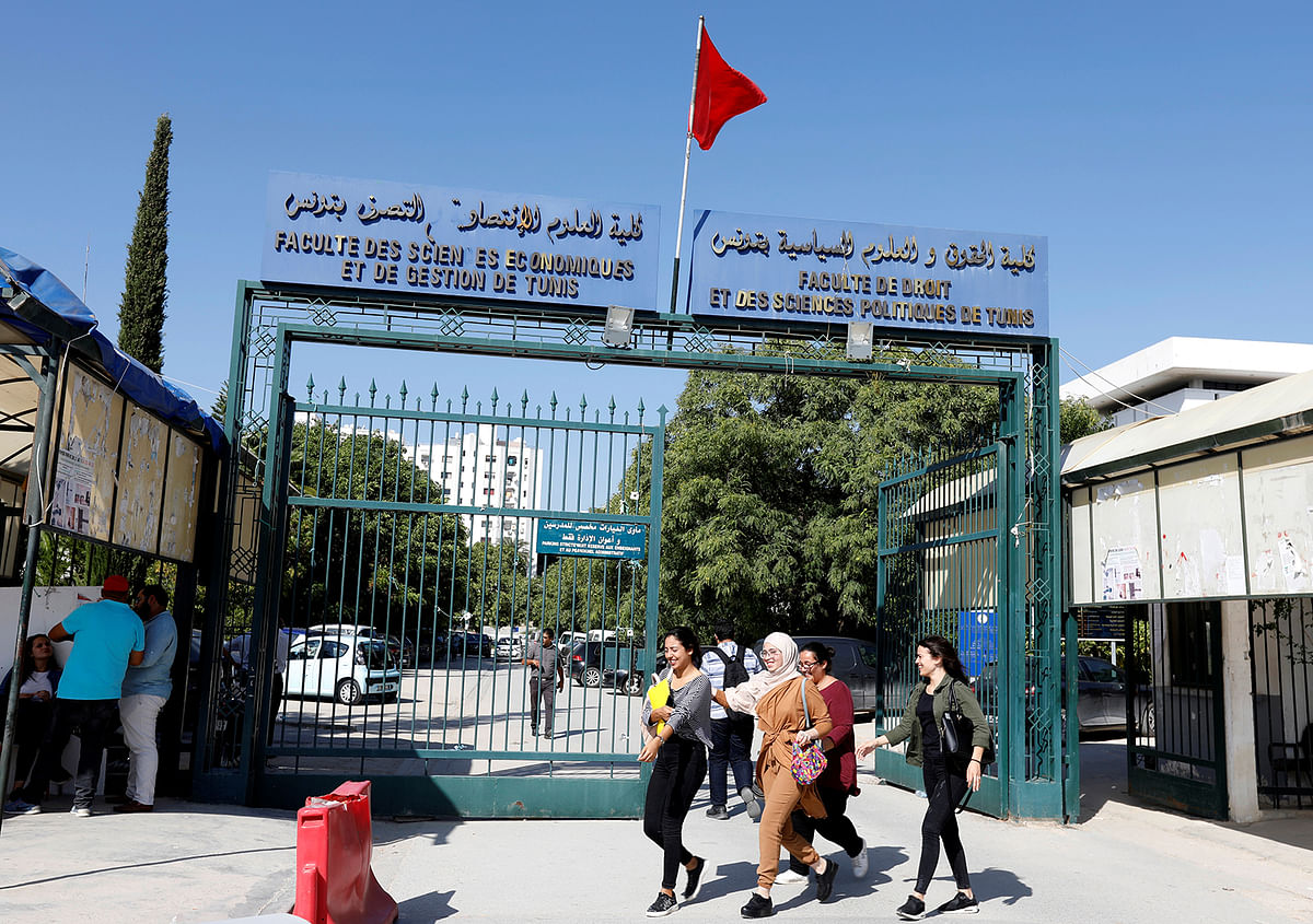 Youths walk outside Manar university in Tunis, Tunisia on 14 October 2019. Photo: Reuters