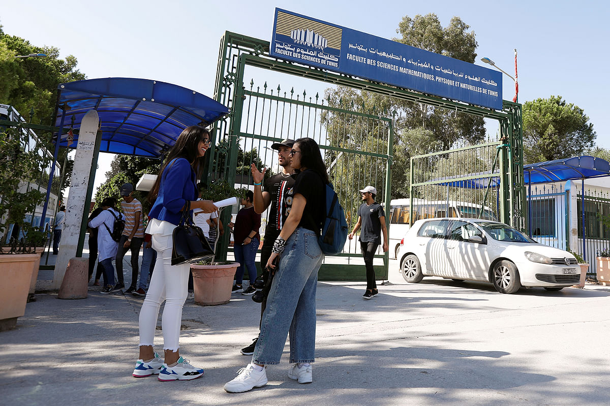 Students stand outside Manar university in Tunis, Tunisia on 14 October 2019. Photo: Reuters