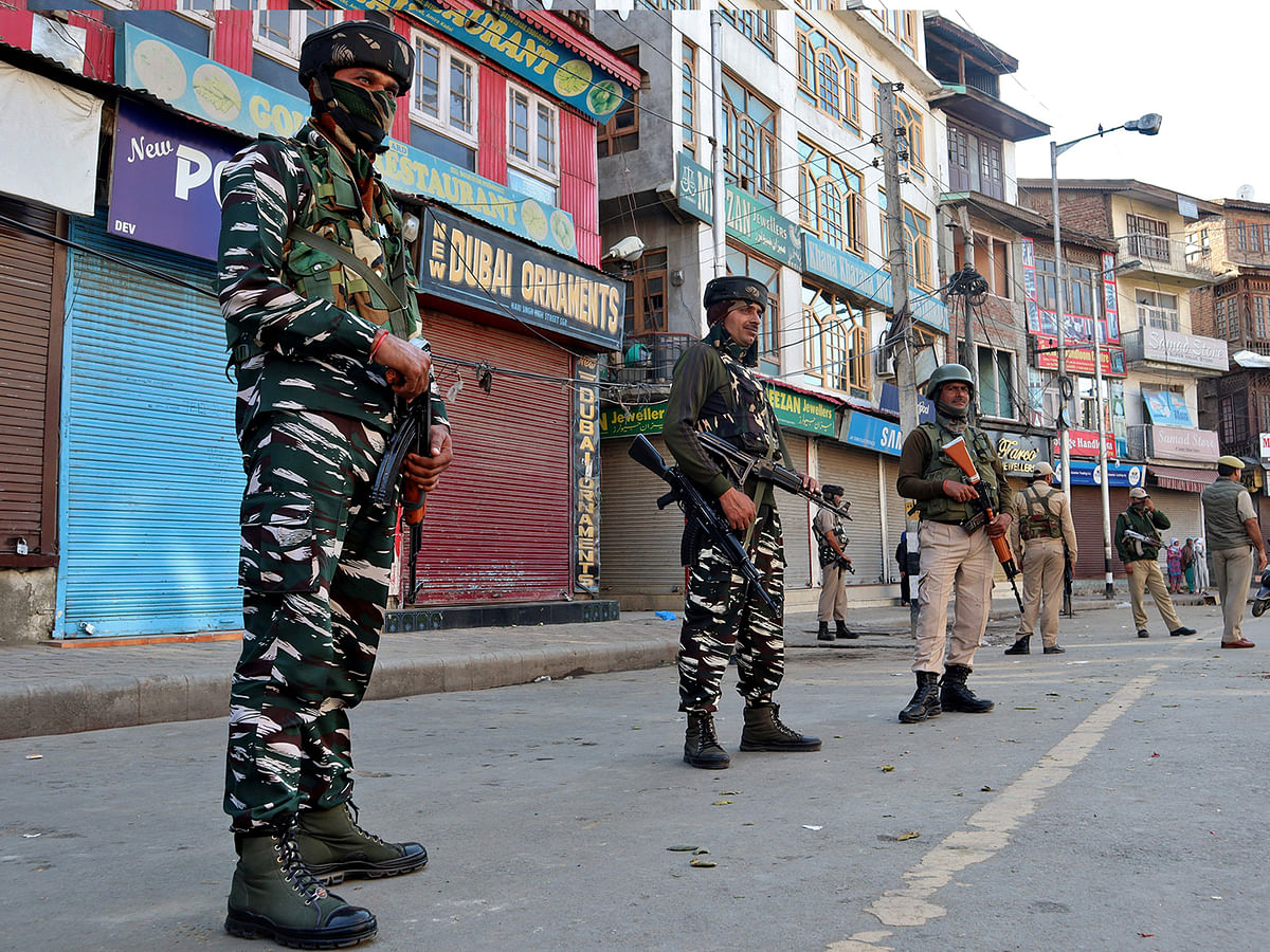 KASIndian security force personnel stand guard after a grenade attack in Srinagar on 12 October 2019. Reuters File Photo