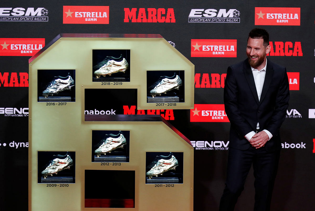 Barcelona`s Lionel Messi poses with his six Golden Shoe`s at Antiga Fabrica Estrella Damm, Barcelona, Spain on 16 October 2019. Photo: Reuters