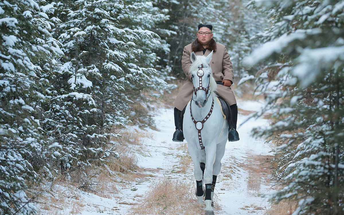 This undated picture released by Korean Central News Agency on 16 October 2019 shows North Korean leader Kim Jong Un riding a white horse amongst the first snow at Mouth Paektu. Photo: AFP
