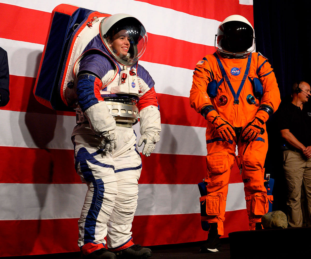 Advance space suit engineer, Kristine Davis (L), stands next to lead engineer of the Orion Crew survival systems, Dustin Gohmert (R) during a press conference displaying the next generation of space suits as parts of the Artemis program in Washington, DC on 15 October 2019. Photo: AFP