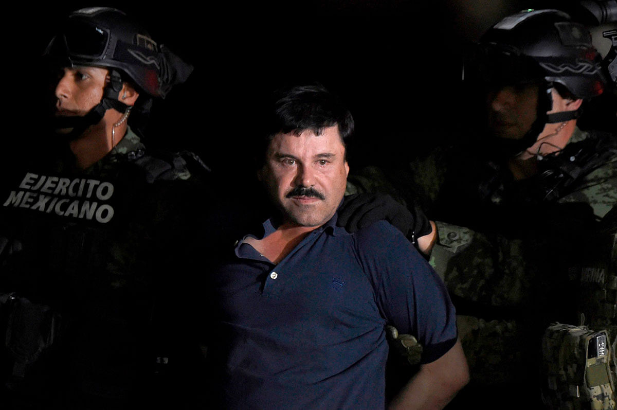 In this file photo taken on 8 January 2016 Mexican Drug kingpin Joaquin `El Chapo` Guzman is escorted into a helicopter at Mexico City`s airport following his recapture during an intense military operation in Los Mochis, in Sinaloa State. Photo: AFP