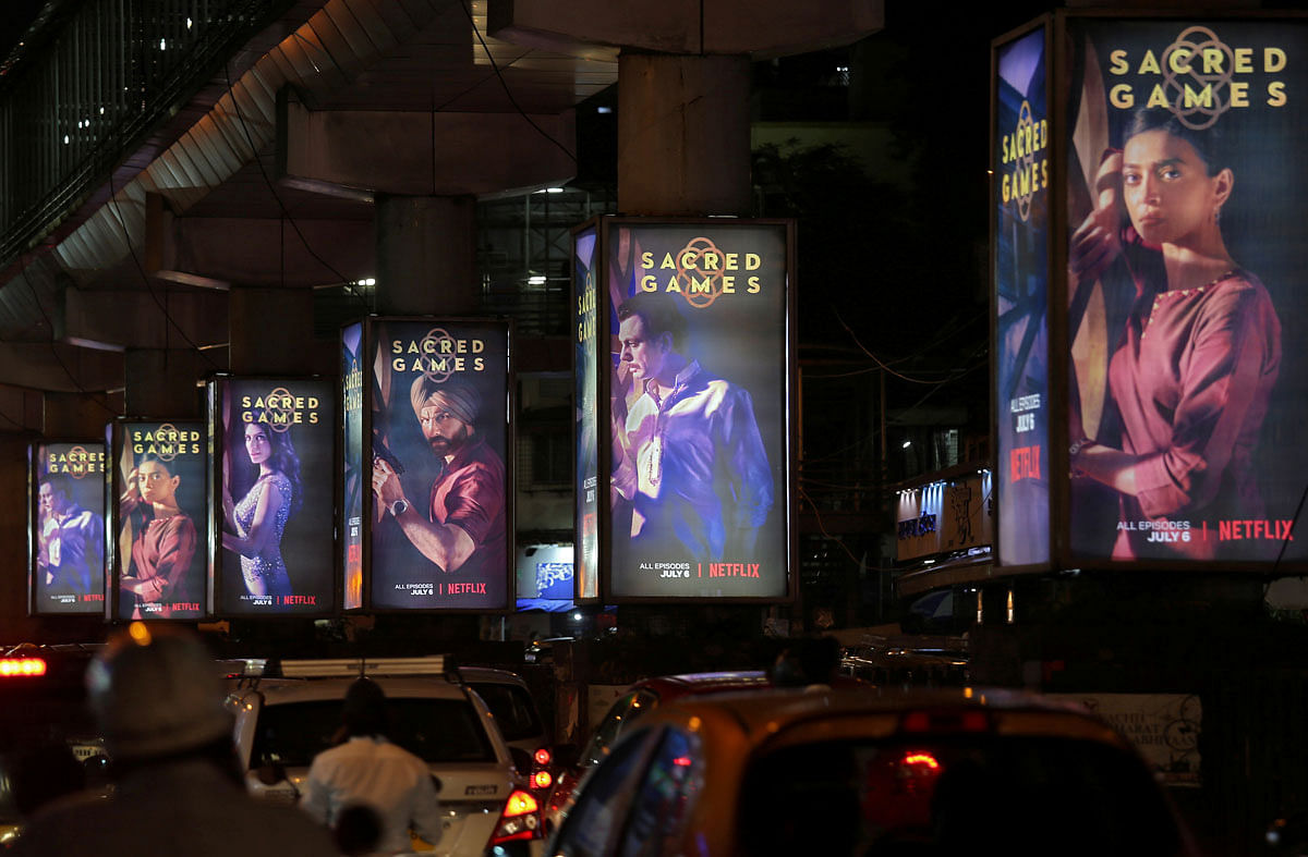 Traffic moves on a road past hoardings of Netflix`s new television series ‘Sacred Games’ in Mumbai, India, on 11 July 2018. Reuters File Photo