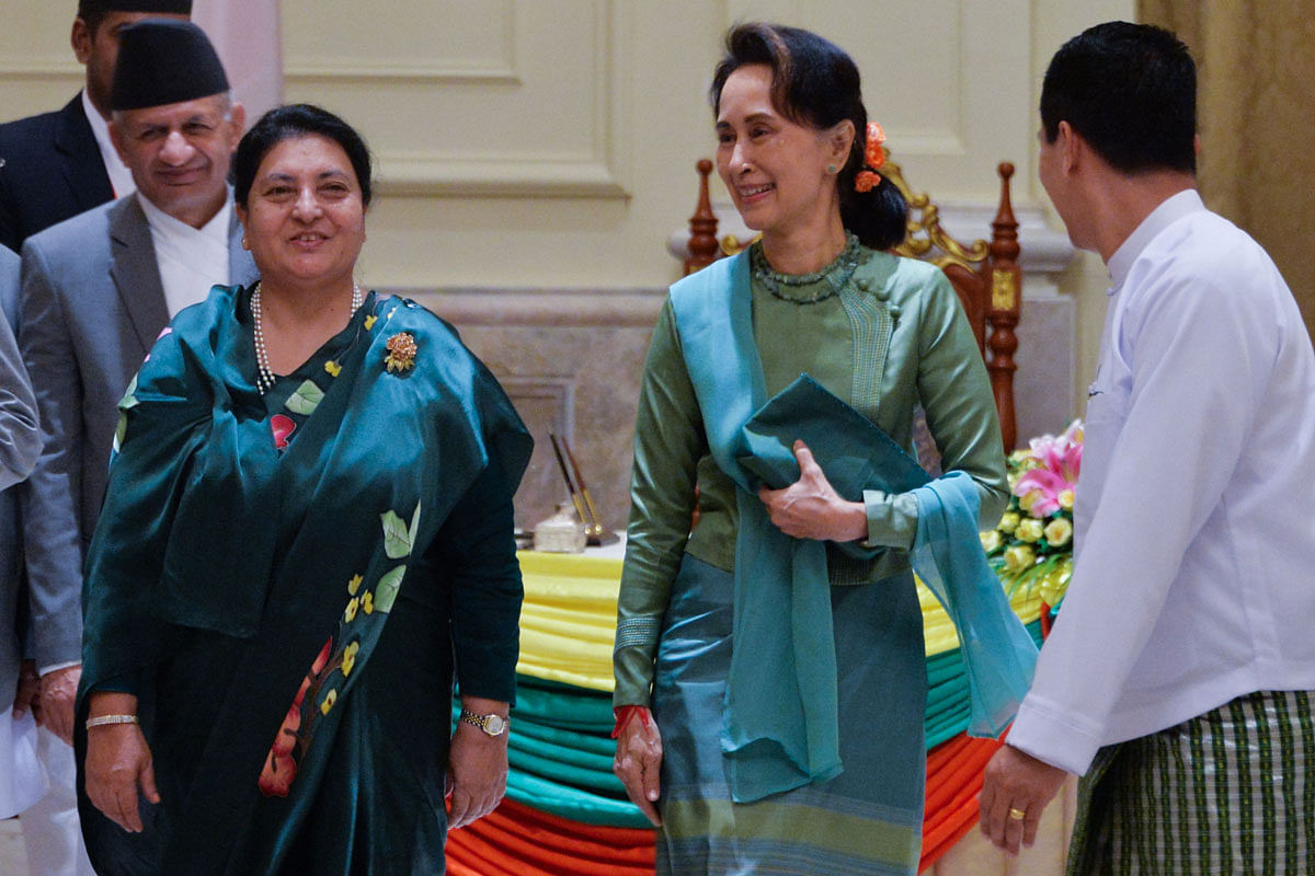 Nepal`s president Bidhya Devi Bhandari (L) and Myanmar`s State Counsellor Aung San Suu Kyi leave after a signing ceremony at the presidential palace in Naypyidaw on 17 October 2019. Photo: AFP