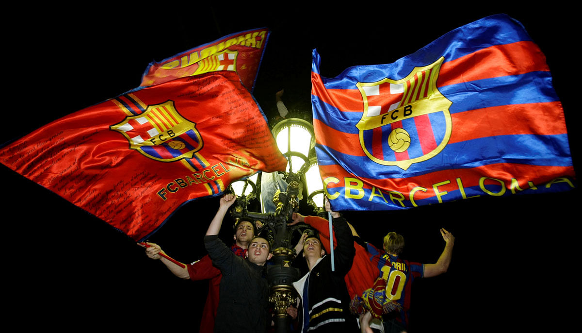 Barcelona`s supporters celebrate their victory against Real Madrid in their Spanish League soccer match in Barcelona. Reuters file photo