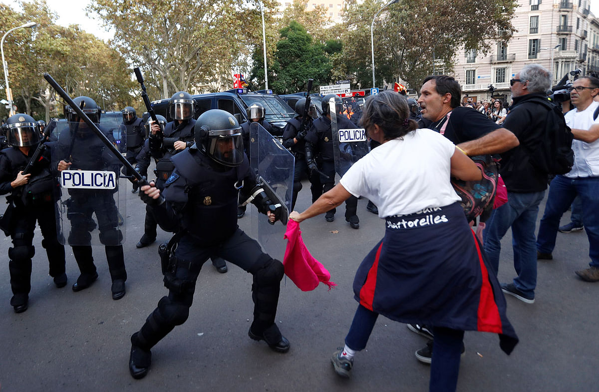 Catalan demonstrators clash with a riot police officer during a protest in central Barcelona, Spain on 19 October 2019. Photo: Reuters