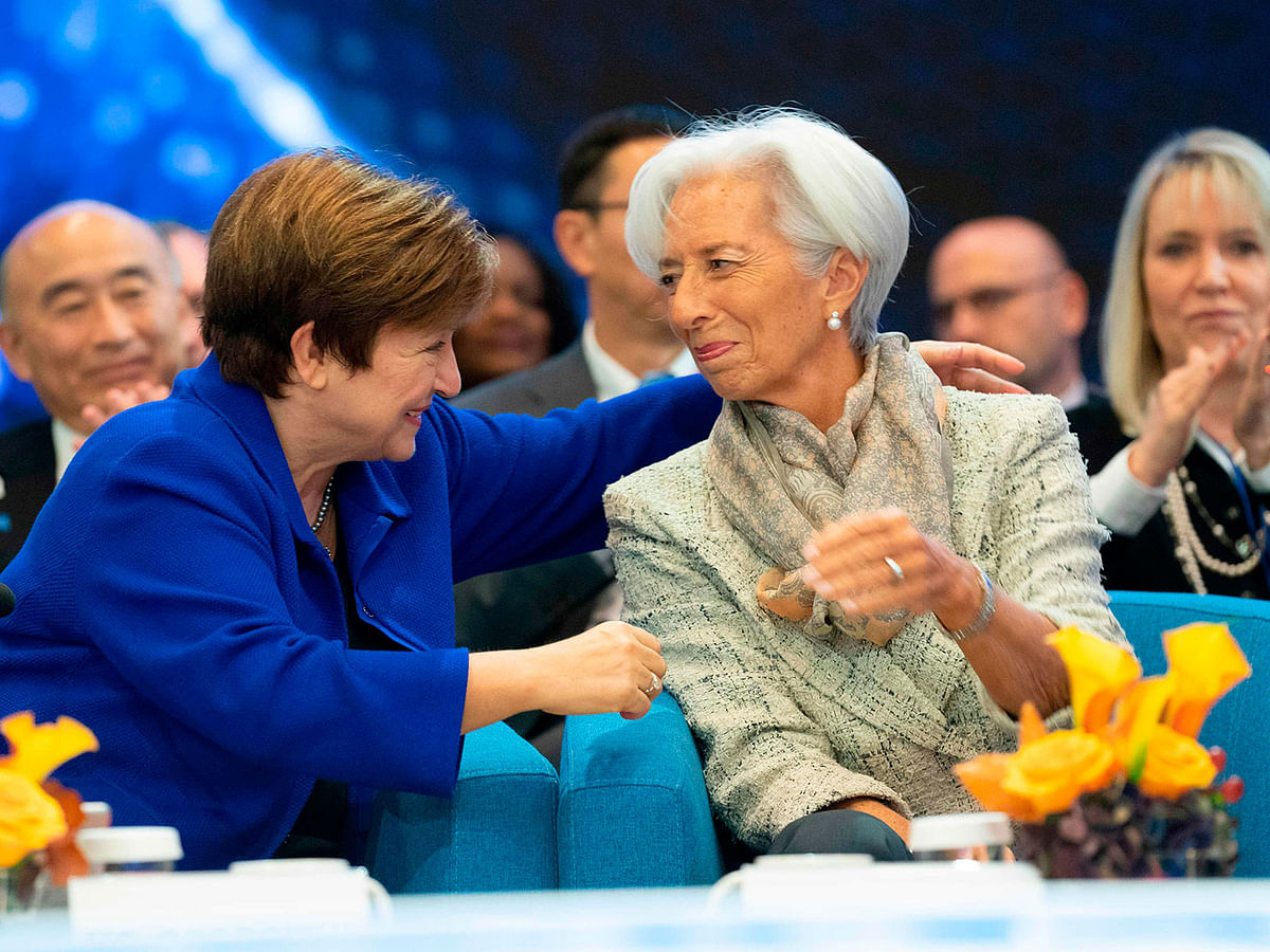 In this image released by the International Monetary Fund, incoming European Central Bank president Christine Lagarde (R) is embraced by International Monetary Fund Managing Director Kristalina Georgieva (L) at the IMF Headquarters during the 2019 IMF/World Bank Annual Meetings on 19 October 2019. Photo: AFP