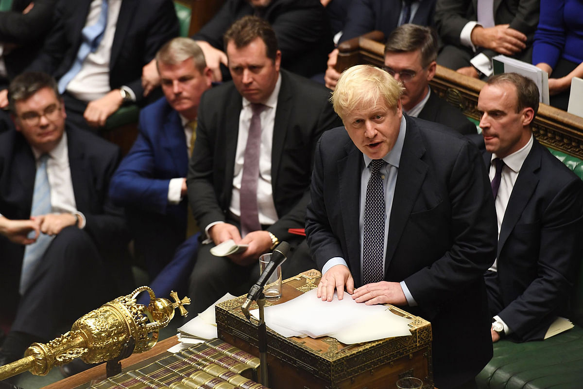 A handout picture released by the UK Parliament shows Britain`s prime minister Boris Johnson (R) speaking in the House of Commons in London on 19 October 2019, during a debate on the Brexit deal. Photo: AFP