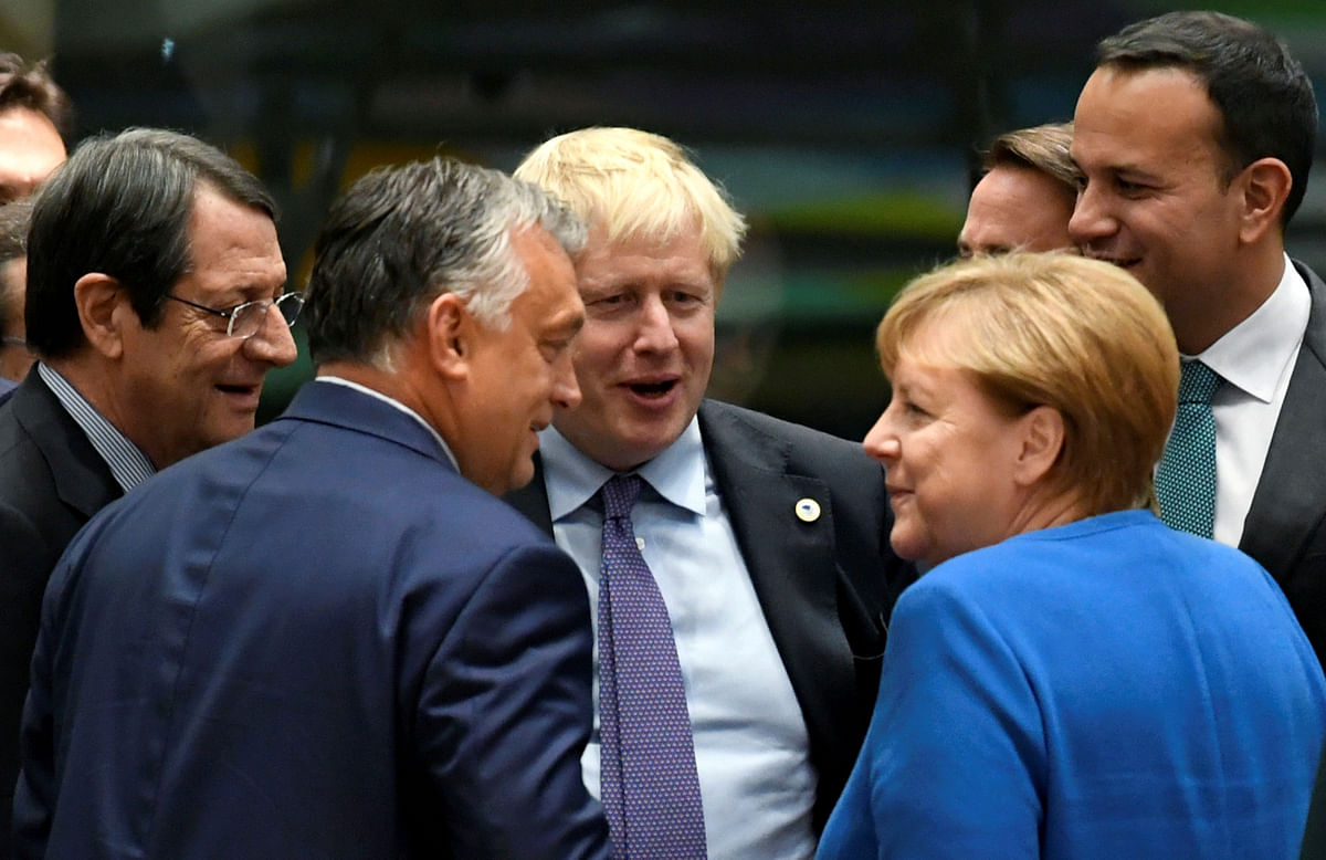 Cypriot president Nicos Anastasiades, Hungarian prime minister Viktor Orban, Britain`s prime minister Boris Johnson, Ireland`s prime minister (Taoiseach) Leo Varadkar and German chancellor Angela Merkel talk as they attend the European Union leaders summit dominated by Brexit, in Brussels, Belgium 17 October 2019. Reuters file photo