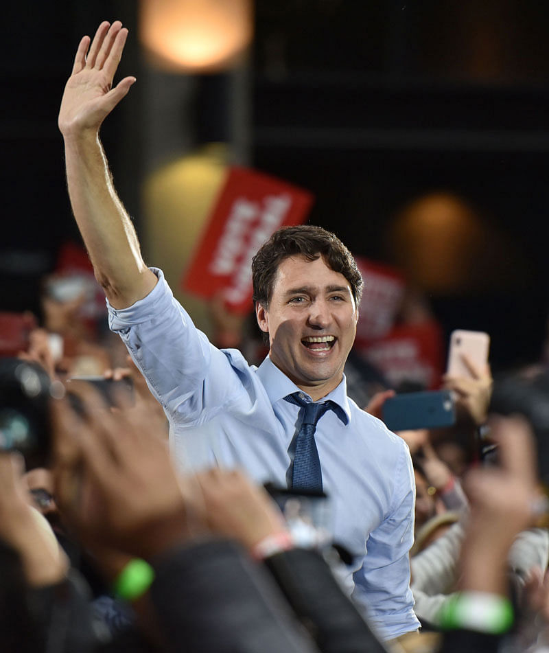 Leader of the Liberal Party of Canada, prime minister, Justin Trudeau, waves to supporters during a `Team Trudeau 2019` Rally at the Woodward’s Atrium in Vancouver BC on 20 October. Photo: AFP