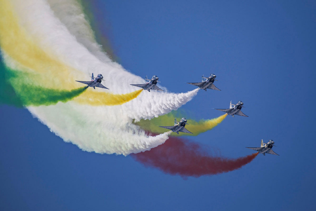 This photo taken on 17 October 2019 shows China`s Bayi Aerobatic Team performing in the sky during the Chinese People`s Liberation Army Air Force Aviation Open Day in Changchun in China`s northeastern Jilin province, to mark the 70th anniversary of the founding of the Chinese People`s Liberation Army Air Force. Photo: AFP