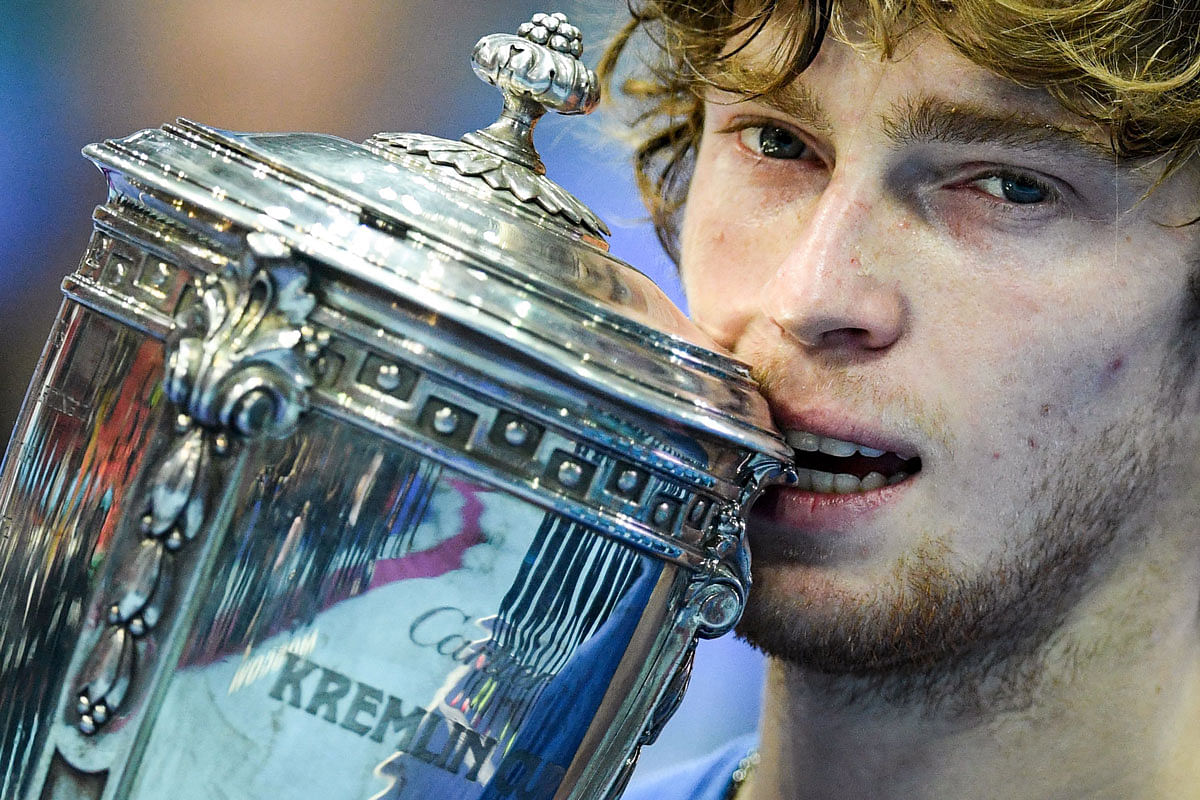Russia`s Andrey Rublev celebrates with his trophy after winning the Kremlin Cup tennis tournament men`s single final match against France`s Adrian Mannarino, in Moscow, on 20 October 2019. Photo: AFP