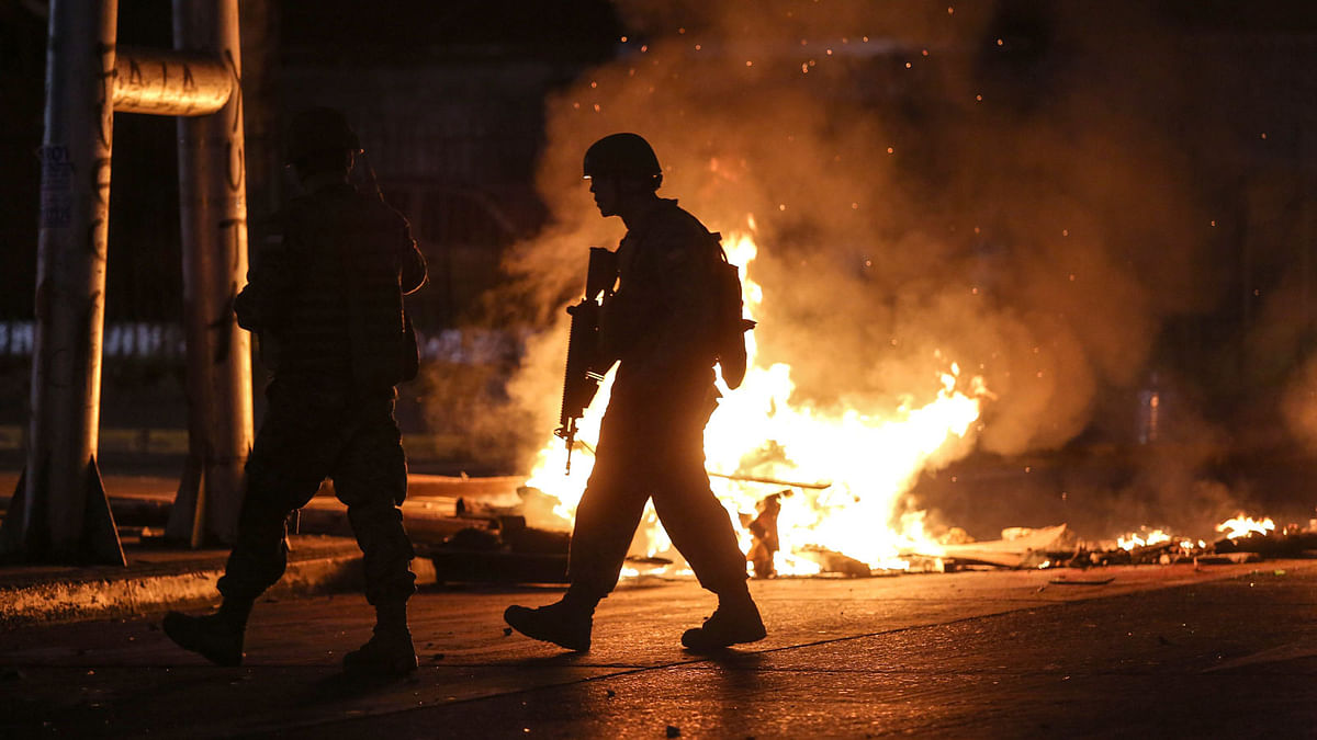 Soldiers patrol the streets of Concepcion, Chile, on 20 October, during protests. Photo: AFP