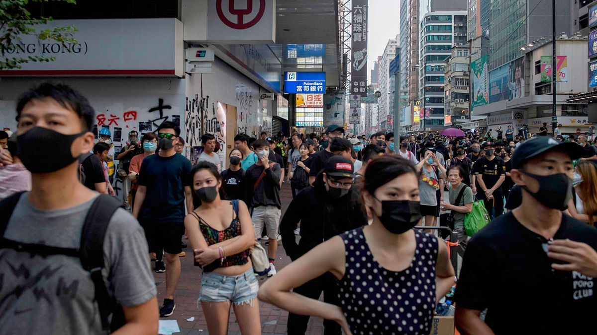 Anti-government protesters gather during a pro-democracy march in the Kowloon district in Hong Kong on 20 October. Photo: AFP
