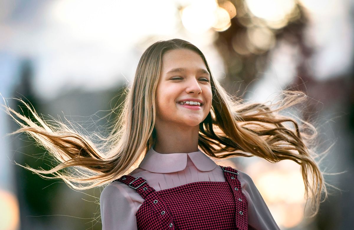 Russian child blogger Liza Anokhina, 12, participates in a shoot for her blog in a Moscow park on 13 September 2019. Liza Anokhina is one of Russia`s most popular child bloggers with 2.3 million followers on Instagram. Photo: AFP