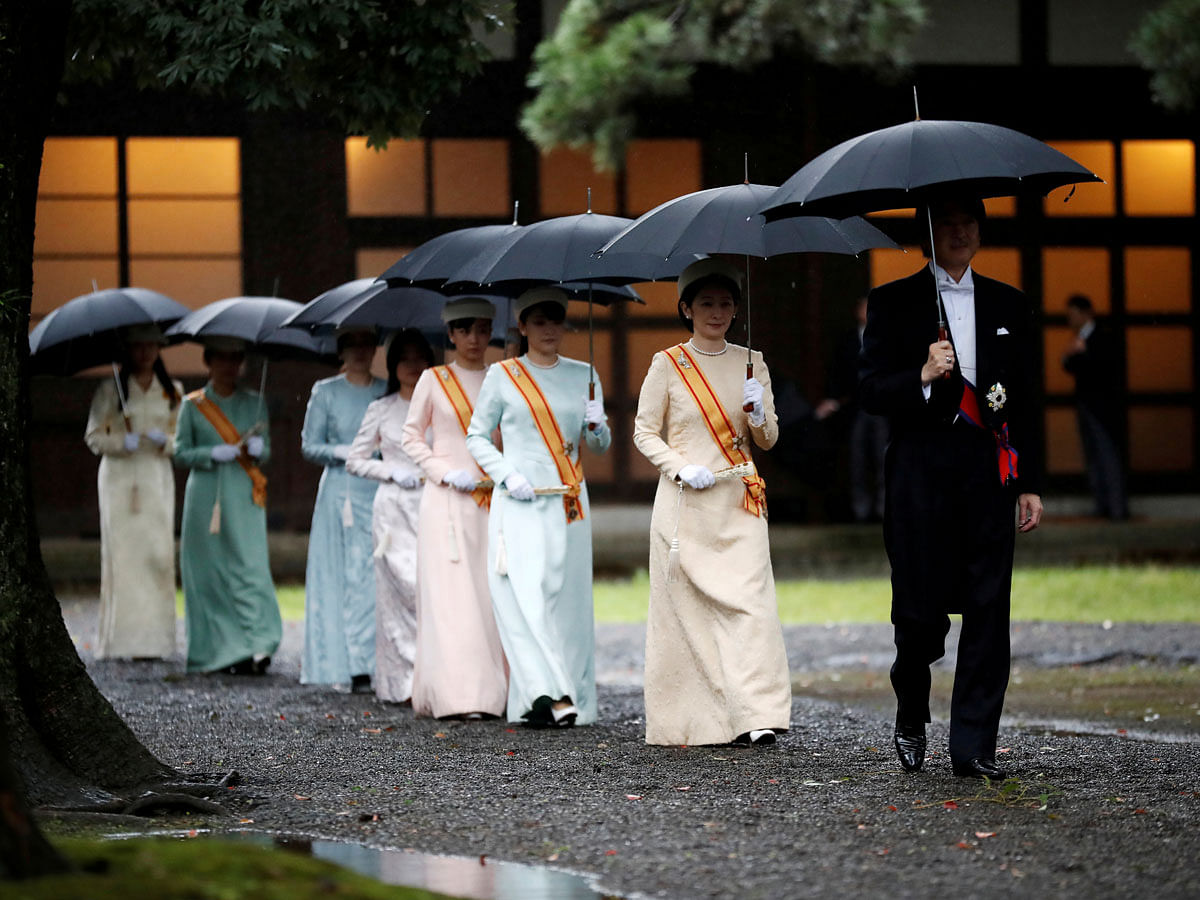 Japan`s Crown Prince Akishino and Crown Princess Kiko arrive at the ceremony site where Emperor Naruhito will report the conduct of the enthronement ceremony at the Imperial Sanctuary inside the Imperial Palace in Tokyo, Japan on 22 October 2019. Photo: AFP