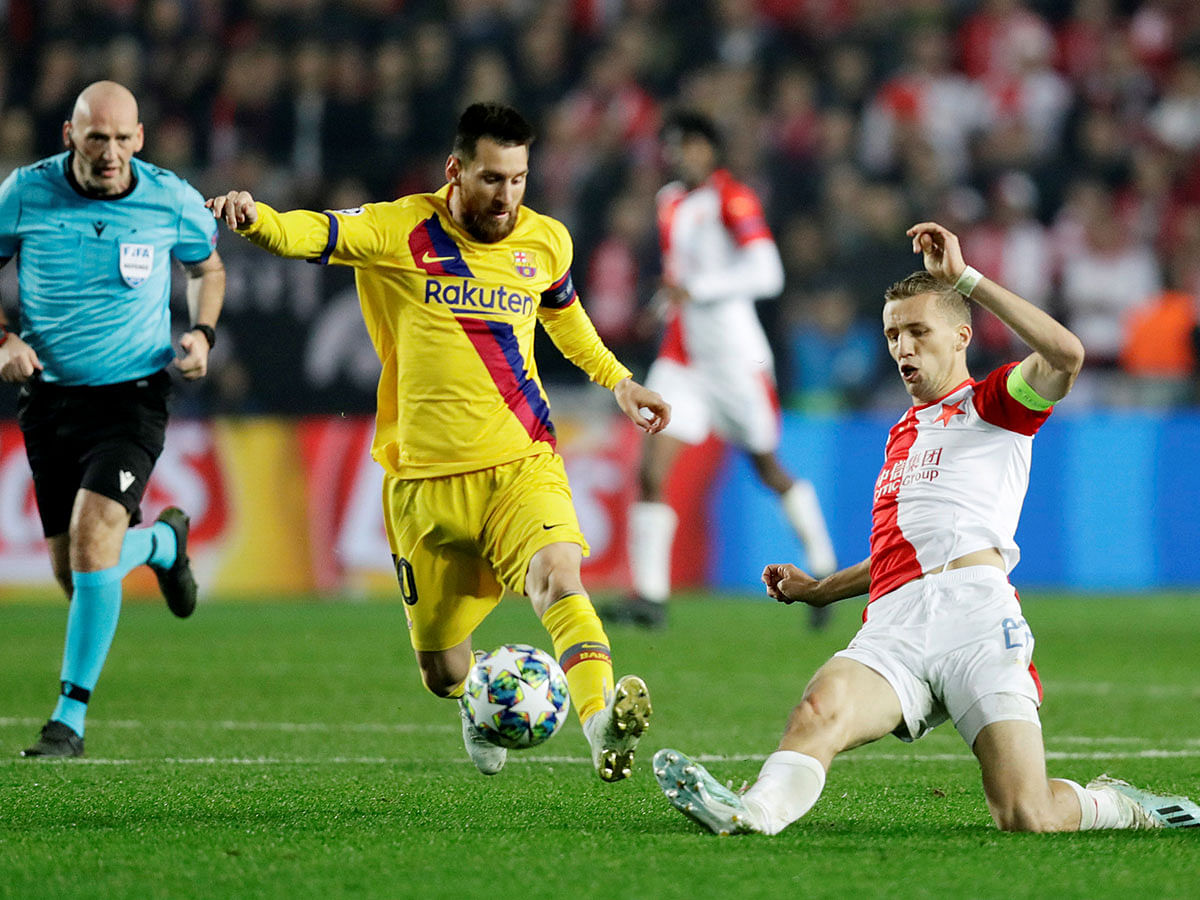 Barcelona`s Lionel Messi in action with SK Slavia Prague`s Tomas Soucek in Champions League Group F match, at Eden Arena, Prague, Czech Republic on 23 October 2019. Photo: Reuters