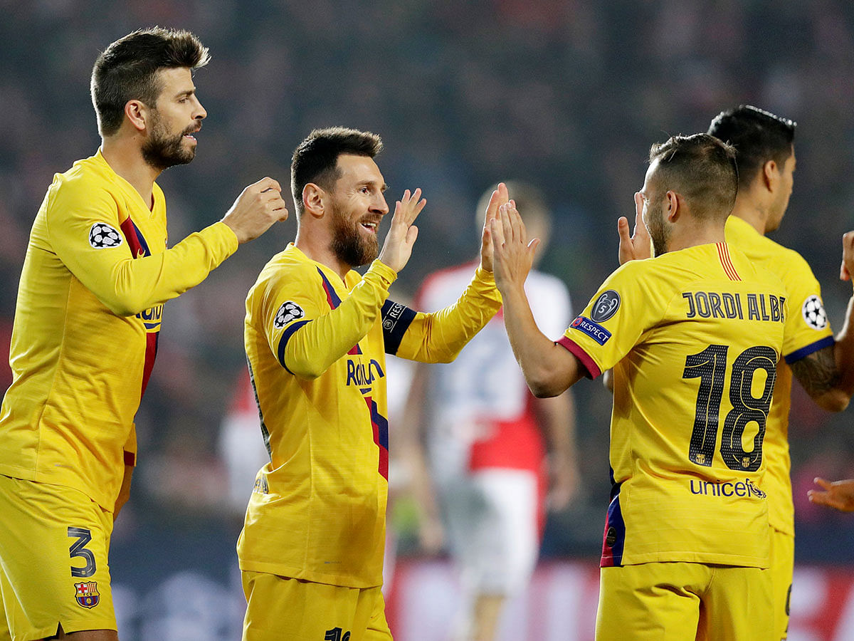 Barcelona`s Lionel Messi celebrates scoring their first goal with Gerard Pique and Jordi Alba in Champions League Group F match, at Eden Arena, Prague, Czech Republic on 23 October 2019. Photo: Reuters