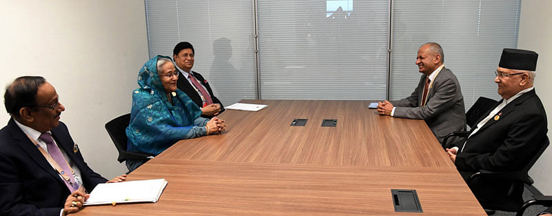 Prime minister Sheikh Hasina meets her Nepalese counterpart KP Sharma Oli met her at the bilateral booth of Baku Congress Centre on the sidelines of the NAM Summit in Baku on Saturday. Photo: PID